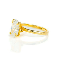 A 1.72ct oval-cut lab diamond engagement ring in 14k solid yellow gold with a prong setting, displayed on a white background.