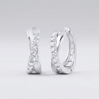 The 10k Gold Round Diamond Hoop Earrings – 1/6 Cttw showcase an elegant crisscross design with sparkling round diamonds set on the front, displayed against a plain light grey background.