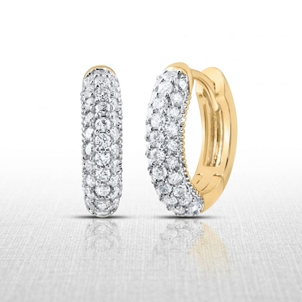 A pair of 5/8CTW Diamond Fashion Hoop Earrings in 14K gold, adorned with sparkling diamonds, displayed on a light textured surface against a white background.