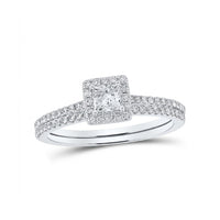 The 14k Gold Princess Diamond Square Halo Wedding Ring Set features a square-cut center diamond surrounded by a sparkling halo, all set on a double band adorned with diamonds for added brilliance.