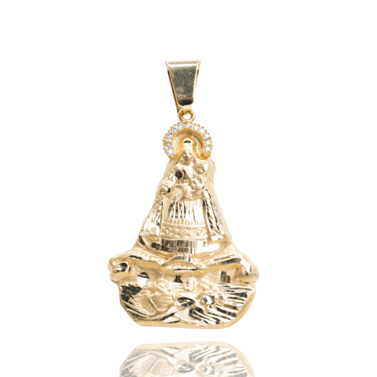 14k solid yellow gold Caridad Del Cobre Pendant with CZ stones, showcasing the Virgin of Charity with a halo and ornate details. The polished piece is photographed on a white background.
