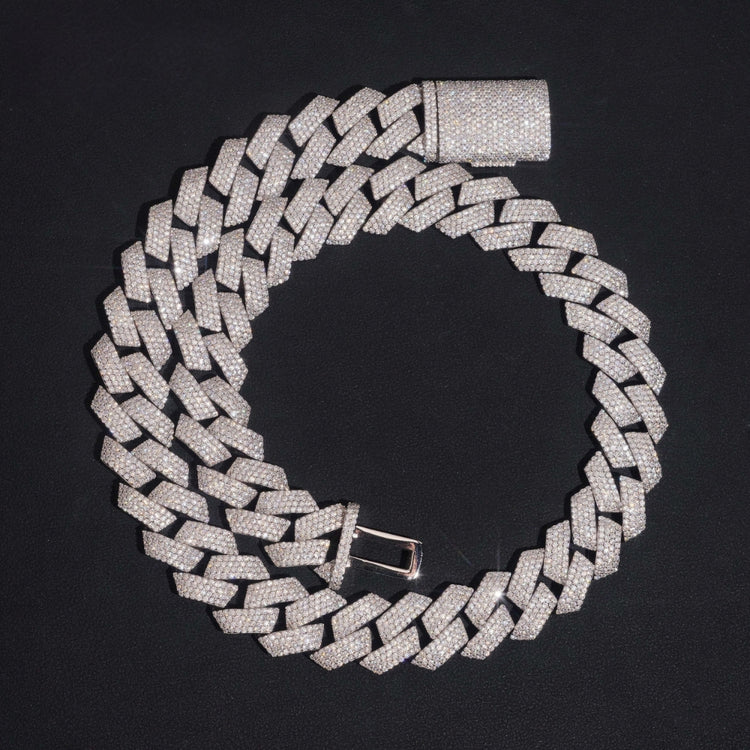 The Moissanite Cuban Links Chain 18mm, crafted from 925 Sterling Silver and encrusted with sparkling stones, is displayed in a spiral arrangement on a black background.