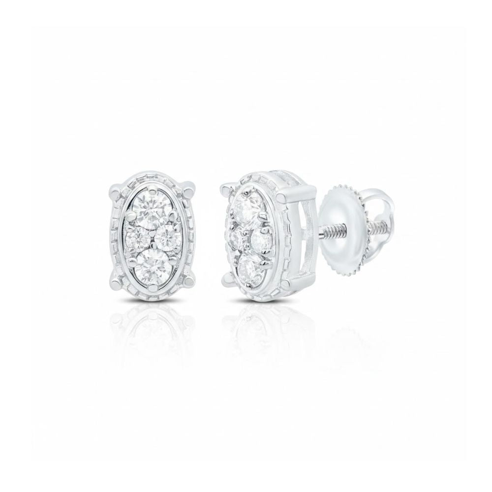 The 1/6 CTW Natural Diamond Oval Earrings feature multiple round, pave-set diamonds in white 10k gold with screw-back closures. A detailed border and reflective surface add elegance to these timeless stud earrings.