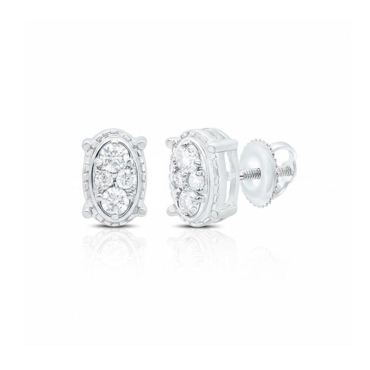 The 1/6 CTW Natural Diamond Oval Earrings feature multiple round, pave-set diamonds in white 10k gold with screw-back closures. A detailed border and reflective surface add elegance to these timeless stud earrings.