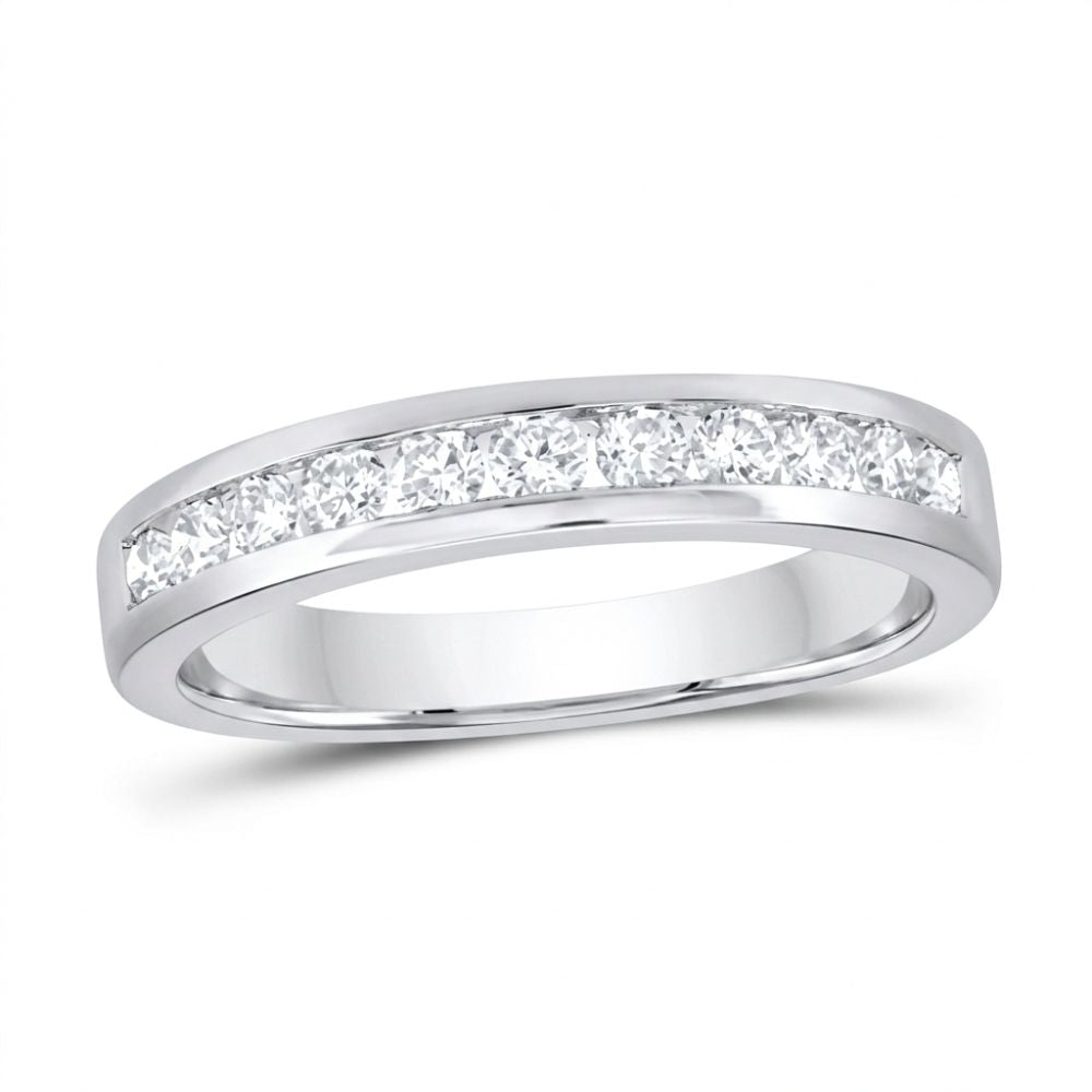 The 14k Gold Diamond Nicole’s Dream Wedding Band 1/2 Cttw showcases a row of round-cut diamonds channel-set along the top of a white gold band, beautifully displayed on a white background.