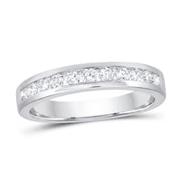The 14k Gold Diamond Nicole’s Dream Wedding Band 1/2 Cttw showcases a row of round-cut diamonds channel-set along the top of a white gold band, beautifully displayed on a white background.