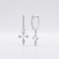 10k Gold Diamond Cross Hoop Dangle Earrings 1/6 Cttw featuring gold hoops with sparkling diamond cross pendants, showcased against a plain white background.