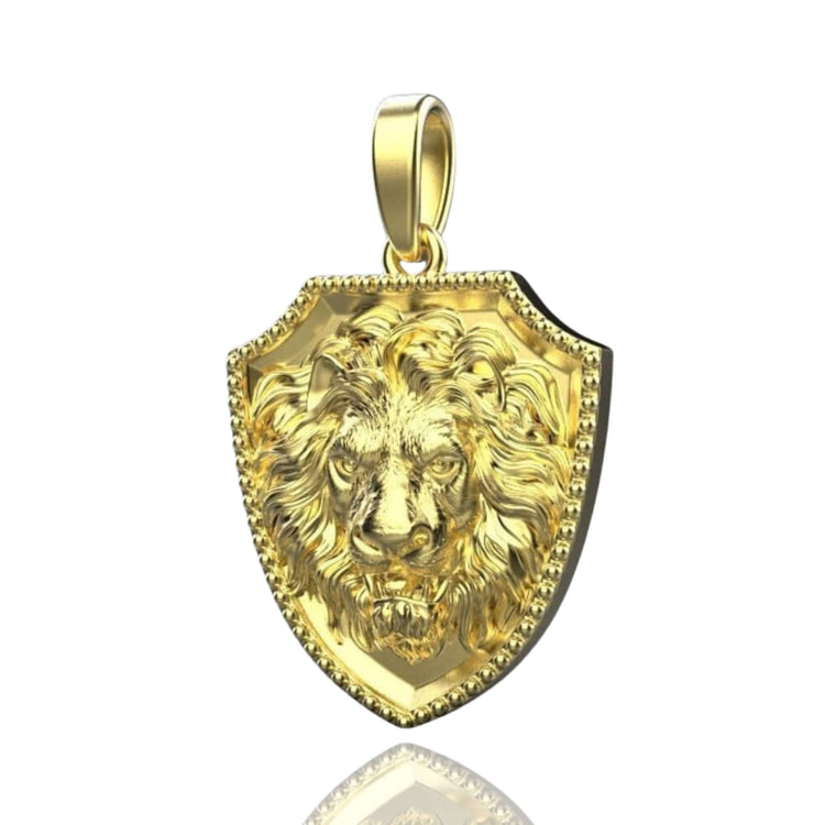 The 14k Gold Lion Shield Pendant showcases a detailed, three-dimensional lion's head at its center on a polished shield design, complete with a top loop for easy attachment to your favorite chain.