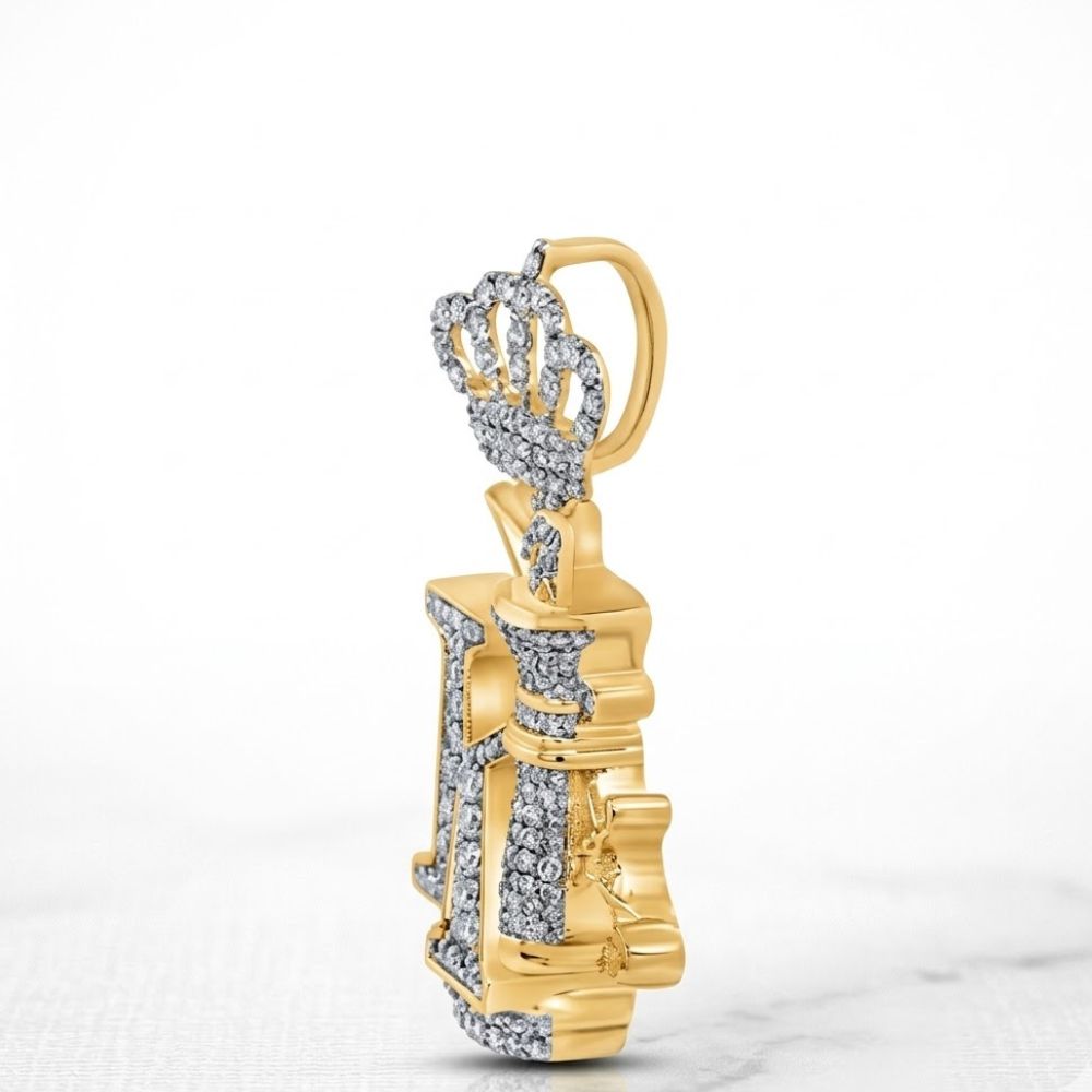 The 10K Gold Diamond King Crown Pendant 1.5CTTW features a crowned chess piece design in yellow gold, adorned with sparkling diamonds for an elegant look, displayed brilliantly against a plain white background.