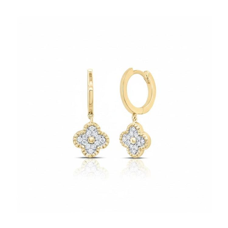 The 1/6CTW Clover Diamond Dangling Earrings in 10K gold feature four-petal clover charms adorned with sparkling diamonds, adding elegance and shine, beautifully presented against a white background.