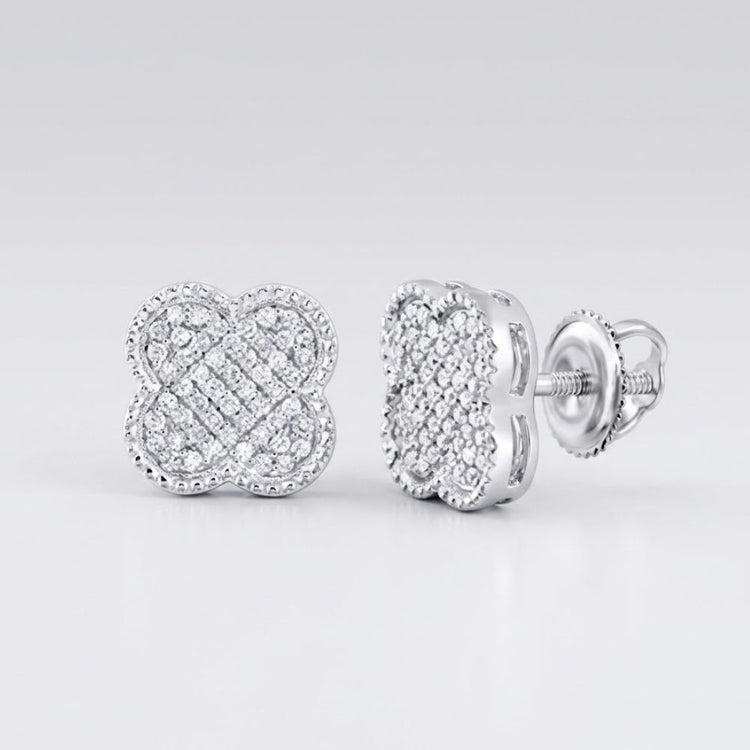 A pair of 1/5CTW Diamond Clover Earrings in 10K gold, perfect as a gift, displayed on a white surface.