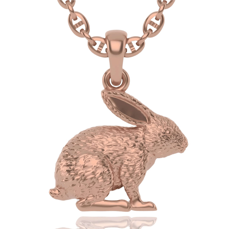The 14k Gold Rabbit Pendant is a rose gold necklace with a nature-inspired, textured rabbit-shaped charm, displayed against a white background.