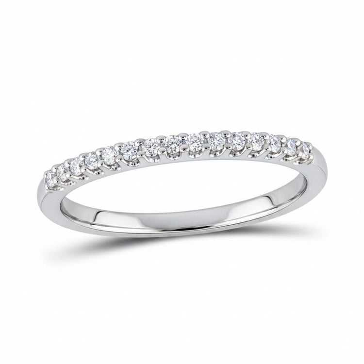 The 14k Gold Diamond Wedding Band 1/2 Cttw from Nicole’s Dream Collection showcases a row of round-cut diamonds set along the top half, beautifully displayed on a plain white background.