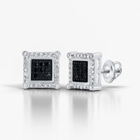 The 10K Gold Black Diamond Square Earrings 1/4 CTTW showcase black center diamonds bordered by small clear stones, set in gold with secure screw-back posts for a striking and elegant jewelry piece.