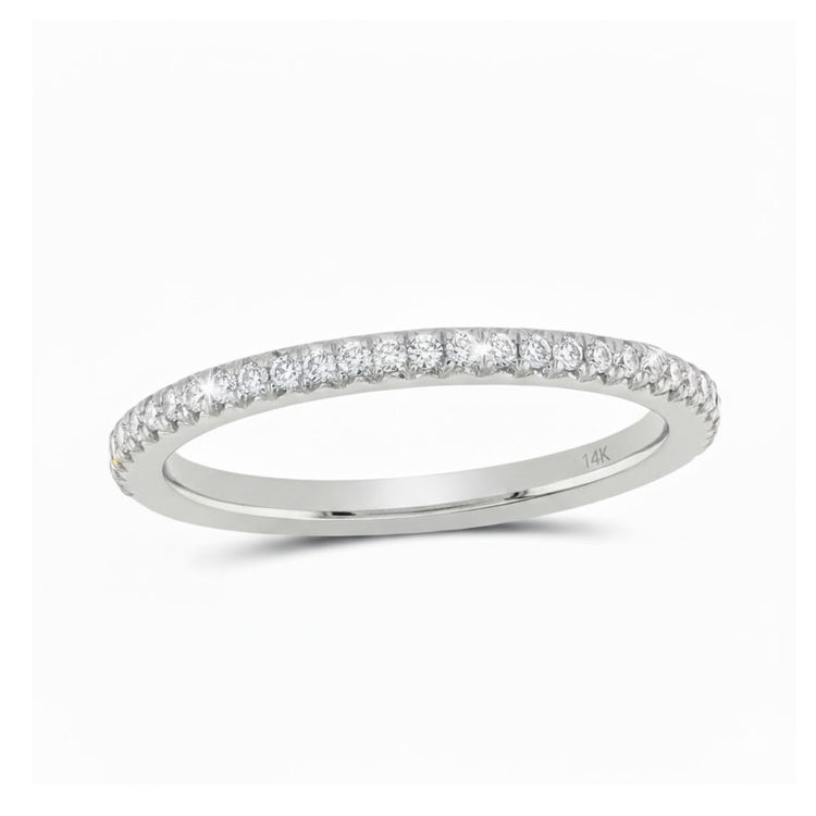 The 14k White Gold Round Diamond Eternity Wedding Band features small round diamonds set along the top half of a thin band, marked with 14K inside and shown against a white background.