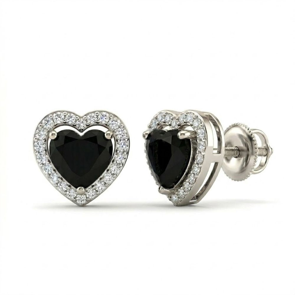 The Heart Black Onyx Diamond Earrings 1/5CTW 10k Gold feature large black onyx hearts at the center, bordered by sparkling diamonds, and set in luxurious 10k gold.