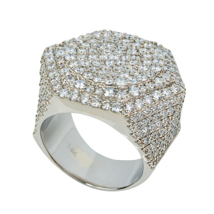 The Iced-Out Octagon Cluster Ring - 6.04 CT - 14k White Gold features a flat-topped hexagonal design, gem-encrusted sides, and a thick band stamped “14K”—a striking diamond masterpiece.