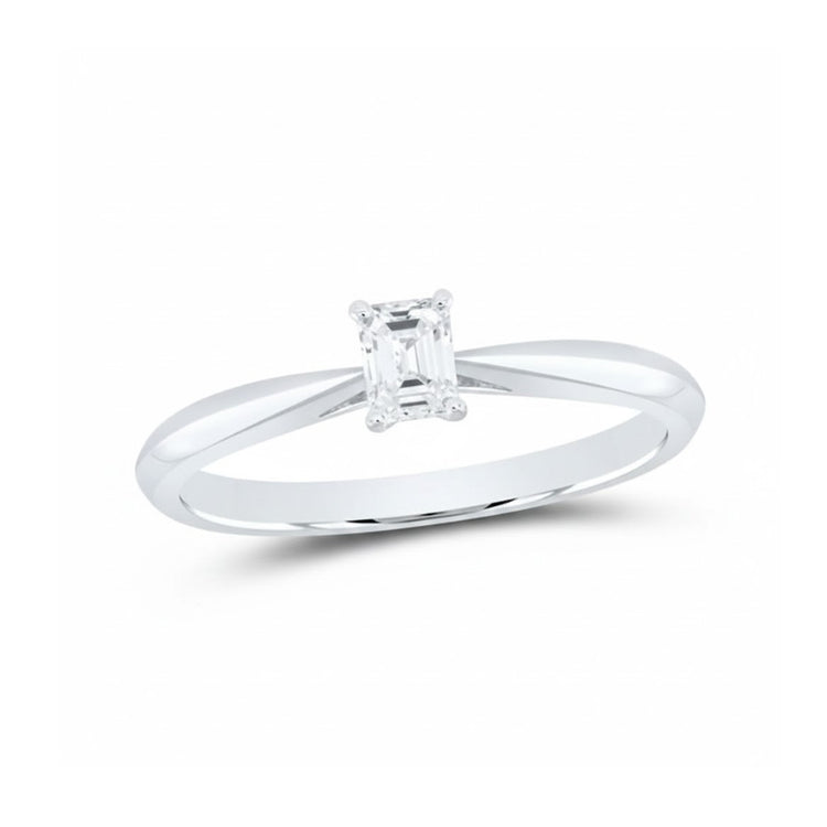 The 1/4CT Diamond Emerald Solitaire Ring in 14K Gold features a natural emerald-cut diamond solitaire set on a plain, polished band, shown against a white background.