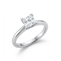 The 14k White Gold Princess Diamond Bridal Ring 3/4 Cttw showcases a princess diamond solitaire on a simple, elegant band, set against a white background.