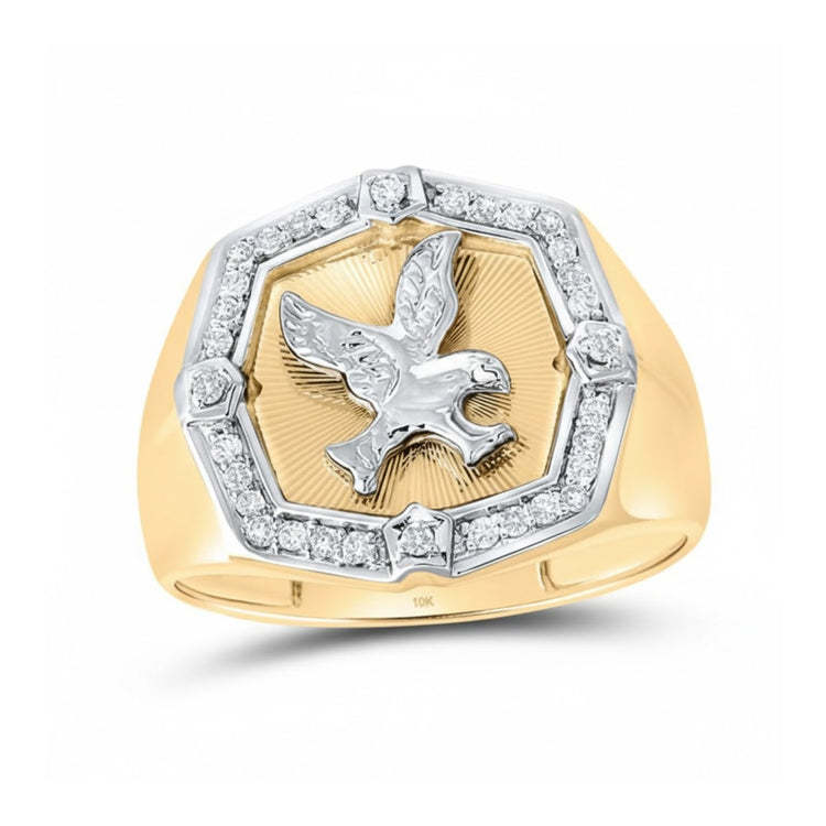 The 10k Yellow Gold Diamond Eagle Ring 1/4 Cttw features a raised eagle at the center, encircled by an octagonal border with diamond accents on each corner and set on a polished, smooth gold band.