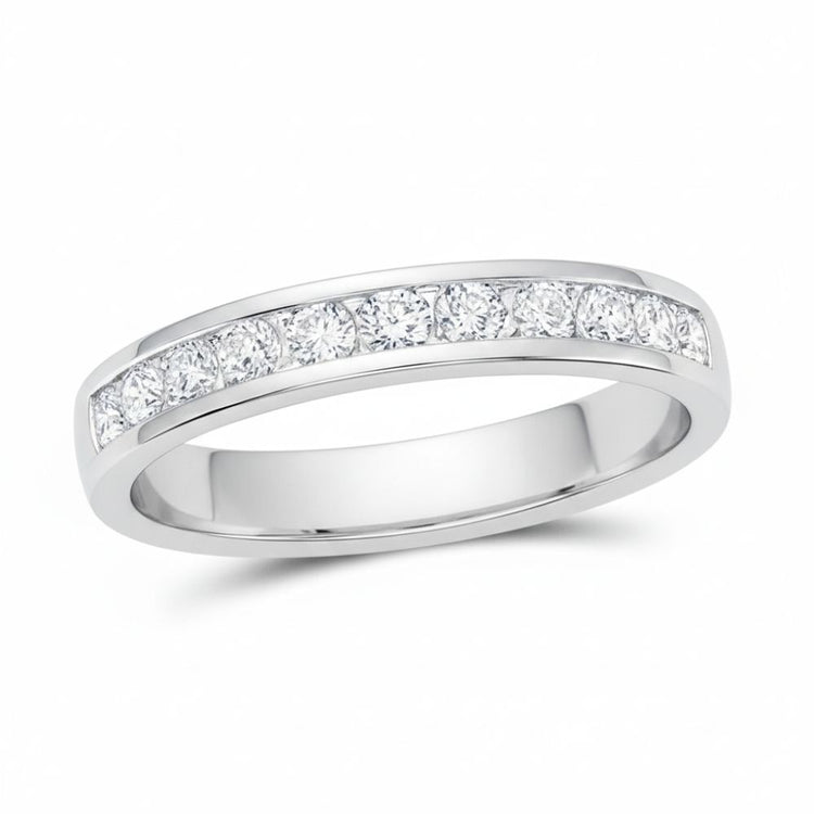 The 14k Gold Round Diamond Single Row Wedding Band 1/2 Cttw showcases seven sparkling round diamonds set in a sleek gold band, elegantly displayed on a white background.