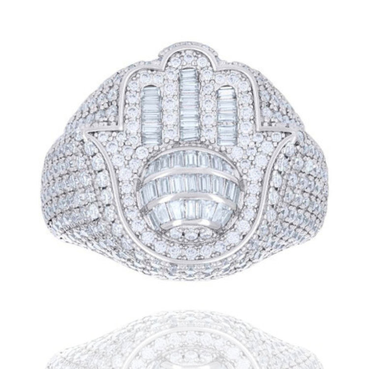 The Baguette Moissanite Hamsa Symbol Religious Ring features shimmering moissanite stones in a Hamsa hand design, symbolizing protection and good fortune—an elegant piece ideal for daily wear.