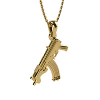 The 14k Gold Mini Draco Pendant is a gold jewelry necklace featuring a 14K gold pendant shaped like a mini Draco, displayed on a plain white background.