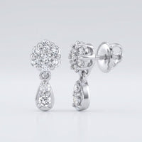 The 10k Gold Diamond Cluster Dangle Earrings 1/4 Cttw feature round-cut diamonds atop teardrop-shaped dangles with extra diamonds, displayed from both front and side views against a white background.