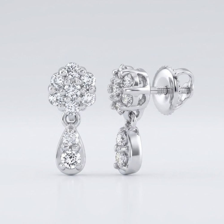 The 10k Gold Diamond Cluster Dangle Earrings 1/4 Cttw feature round-cut diamonds atop teardrop-shaped dangles with extra diamonds, displayed from both front and side views against a white background.