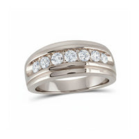 The 10k Gold Diamond Channel-Set Wedding Band Ring showcases seven round-cut diamonds totaling 1 carat, set in a wide, polished band of gold.