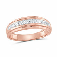 A 10k two-tone gold diamond wedding band – 1/4 cttw, featuring a row of round white diamonds set in a channel across the top, displayed on a plain white background.