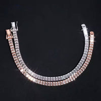 Two elegant tennis bracelets are shown on a black background: one is rose gold with rectangular clear stones, the other is the Emerald Cut Moissanite Tennis Bracelet in 925 sterling silver.