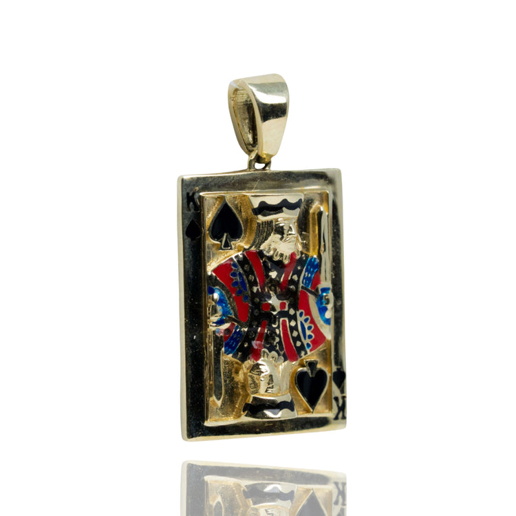 The King of Spades Card Pendant in 10K Gold is a men's gold pendant shaped like a rectangular playing card, with a detailed red, blue, black, and gold King of Spades design and a top loop for attaching to a necklace.