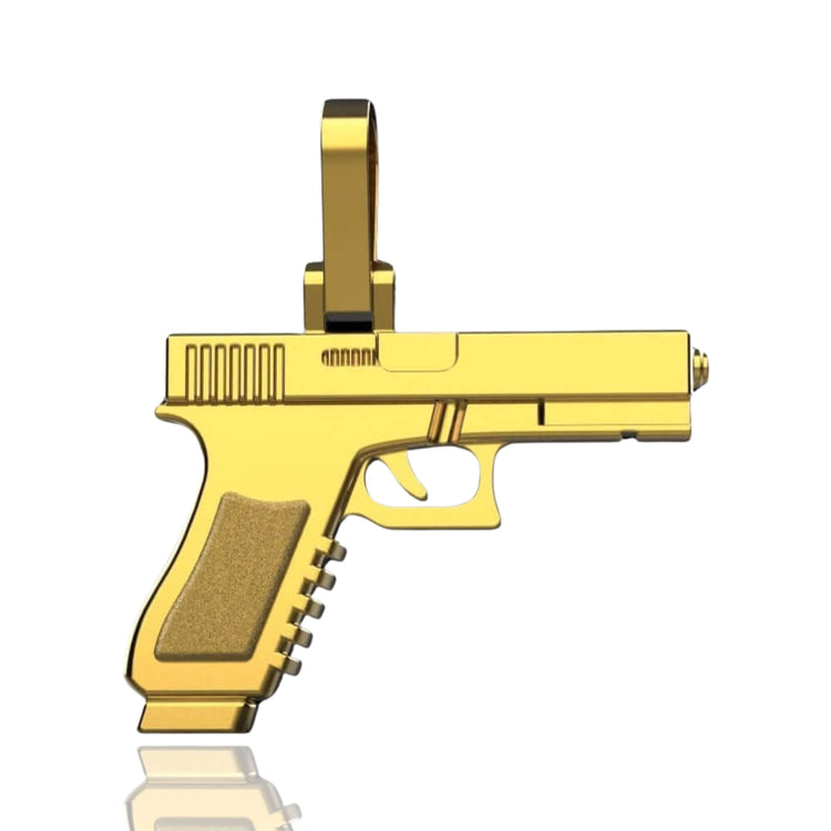 The 14k Gold Pistol Pendant, shaped like a handgun and shown on a white background, includes a small top loop for easy chain attachment.
