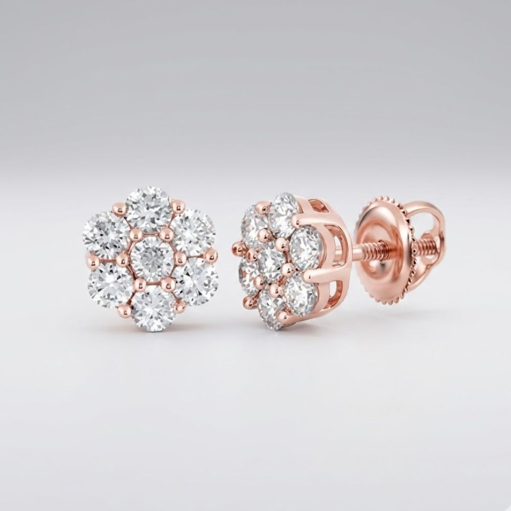 The 10k Gold Diamond Flower Cluster Earrings 1 Cttw feature round, sparkling diamonds in a radiant rose gold setting, displayed on a light gray background.