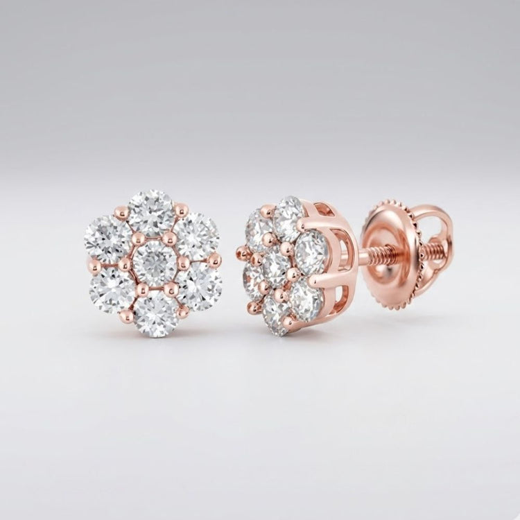 The 10k Gold Diamond Flower Cluster Earrings 1 Cttw feature round, sparkling diamonds in a radiant rose gold setting, displayed on a light gray background.