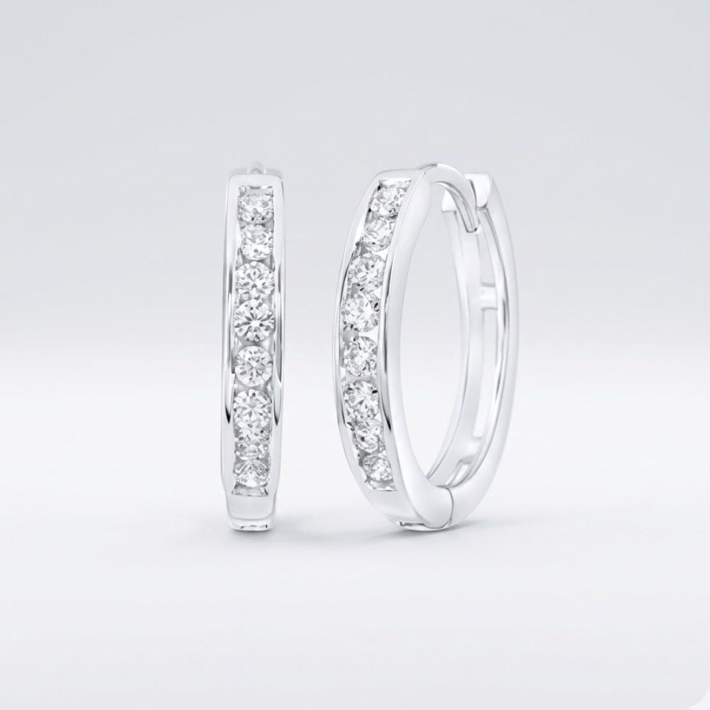 The 10K Diamond Hoop Earrings 1/4 CTTW Gold feature rows of sparkling natural diamonds set in 10K gold, displayed upright against a plain light background.