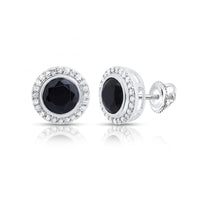 The 1/4 CTW Diamond Round Onyx Black Earrings showcase a central black onyx framed by a halo of sparkling diamonds, all set in polished silver with secure screw-back closures.