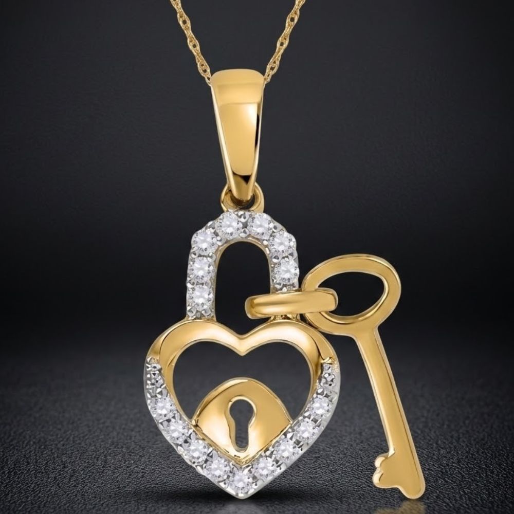 The 10k Gold Diamond Heart Lock Key Pendant (1/10 CTTW) features a yellow gold heart-shaped lock with a central keyhole and a delicate heart key dangle, beautifully set against a dark background.