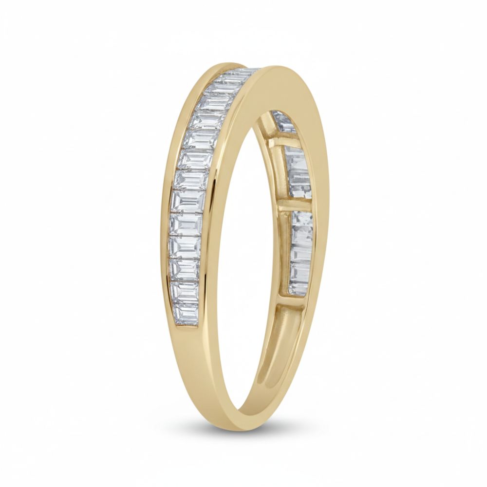 The 10k Yellow Gold Baguette Diamond Wedding Band 1/2 Cttw features sparkling rectangular baguette diamonds set in a channel along the band, shown against a white background.
