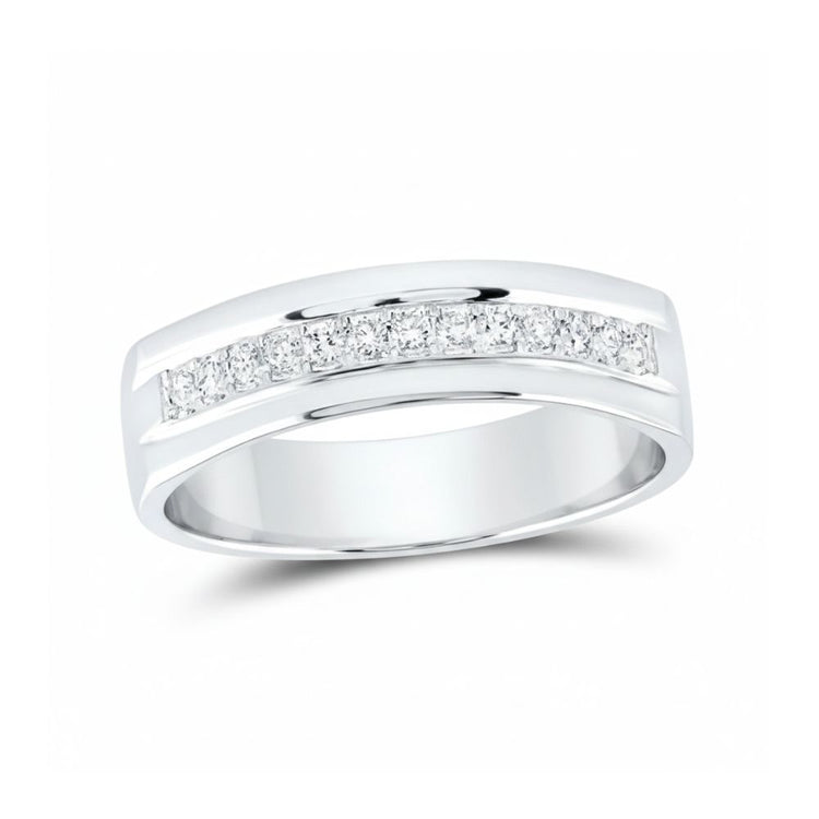 The 14k Gold Single Row Diamond Wedding Band – 1/5 Cttw features channel-set round diamonds in a sleek gold band, sparkling elegantly across the top and showcased on a white background.