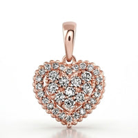 The 1/2 CTW Diamond Heart Pendant in 14K Gold showcases a double halo of round diamonds and a smooth bail, making it easy to wear and a timelessly elegant choice for any necklace.