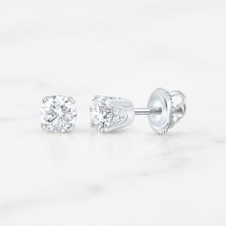 14k Gold Round Diamond Solitaire Earrings 5/8 CTW in round diamond stud style with metal settings and screw-on backs.