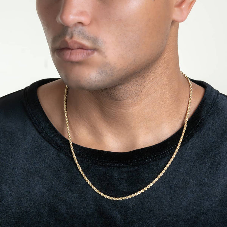 A person wearing a black shirt and the Gold Rope Chain - 3mm, shown from shoulders to just above the lips, against a plain light background.