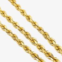 Close-up of three Gold Rope Chains - 7mm, arranged diagonally on a white background. Each chain features twisted, intricate links that create a textured and reflective 14k gold surface.