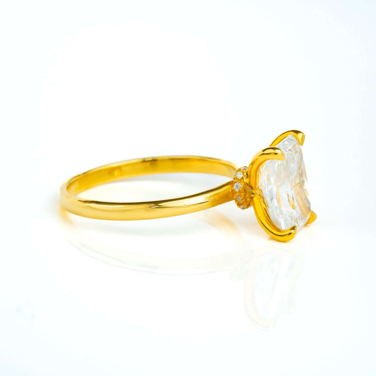 The 3.01ct Radiant Lab Diamond Solitaire Engagement Ring in 14k solid yellow gold features a large, clear radiant-cut lab diamond in a prong setting, shown from the side on a white background.