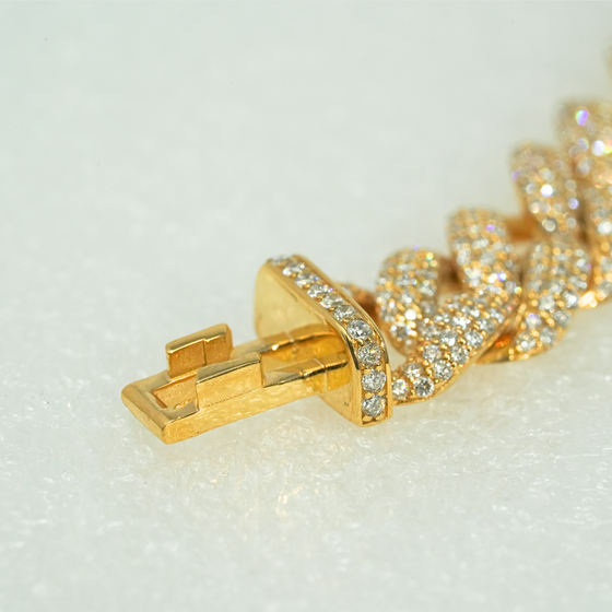 11mm iced-out Cuban link chain with 21ct lab-grown diamonds in 10k gold, featuring a secure clasp on a white background.