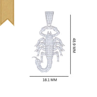 The Silver Moissanite Scorpio Charm Pendant, featuring sparkling clear stones and measuring 48.9 mm by 18.1 mm, is shown with a gold ribbon in the top left corner.