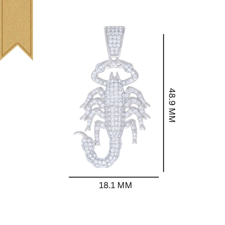 The Silver Moissanite Scorpio Charm Pendant, featuring sparkling clear stones and measuring 48.9 mm by 18.1 mm, is shown with a gold ribbon in the top left corner.