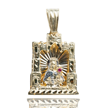The St. Barbara Castle Shaped Pendant – 10k Gold features a church window design with a sculpted figure in a silver-toned robe, red gem detail, radiant lines, and textured frame—perfect for men’s religious jewelry collections.